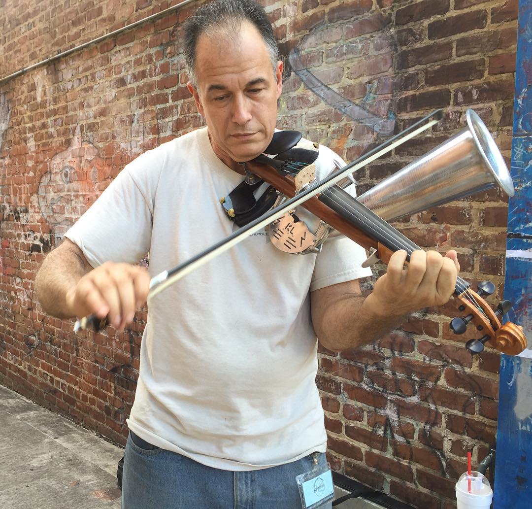 Paul playing a Stroh violin in Northshore district Chattanooga