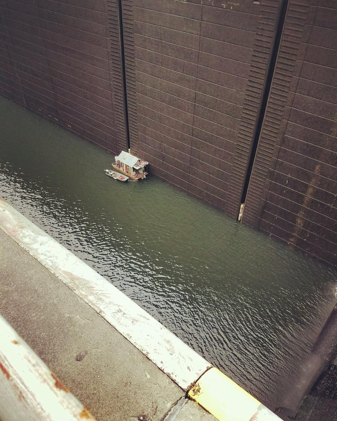 Tiny tiny shantyboat 93 feet down at the bottom of Wilson Lock and Dam