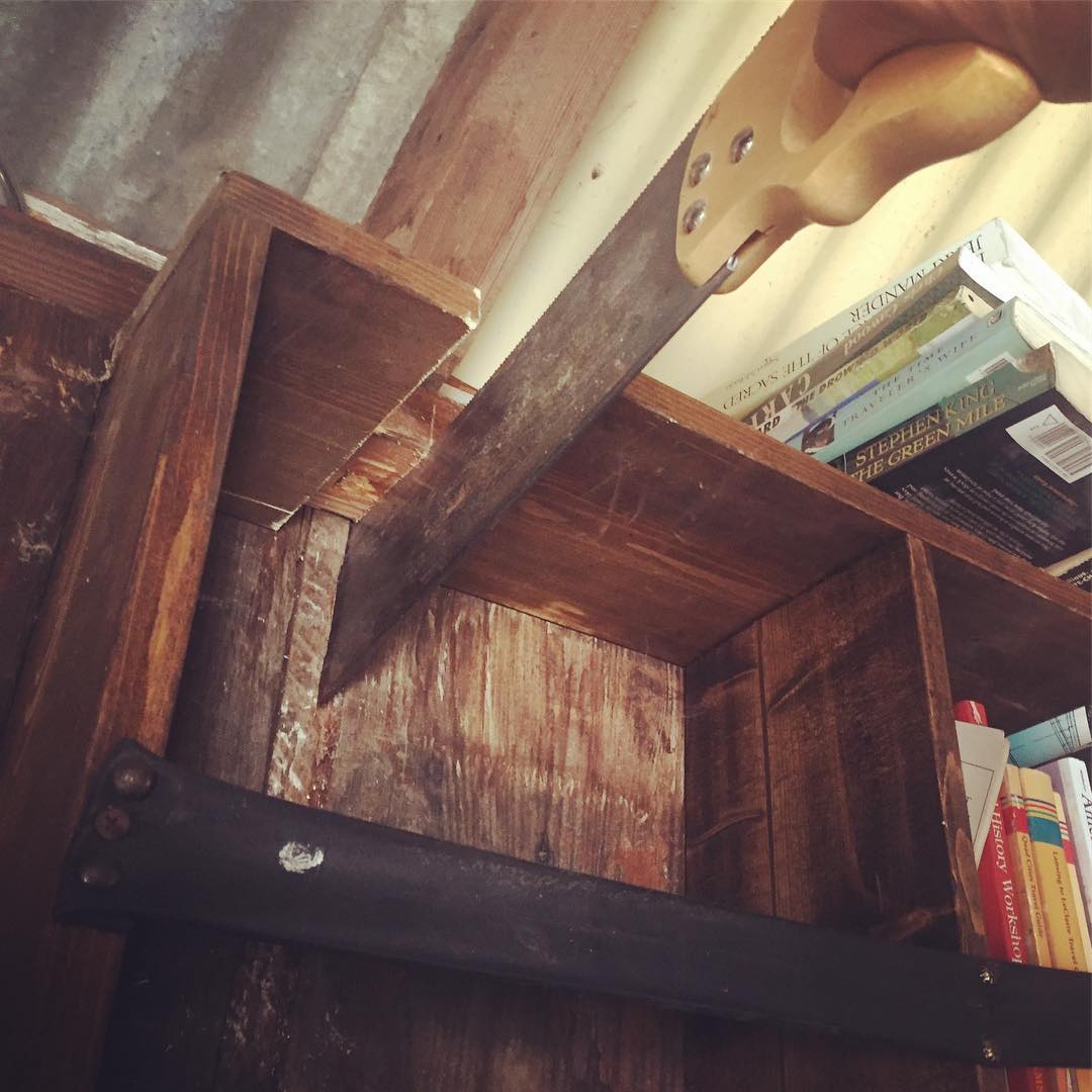 Weird things afoot – cutting into the shelves for a crossbeam to support the extended loft