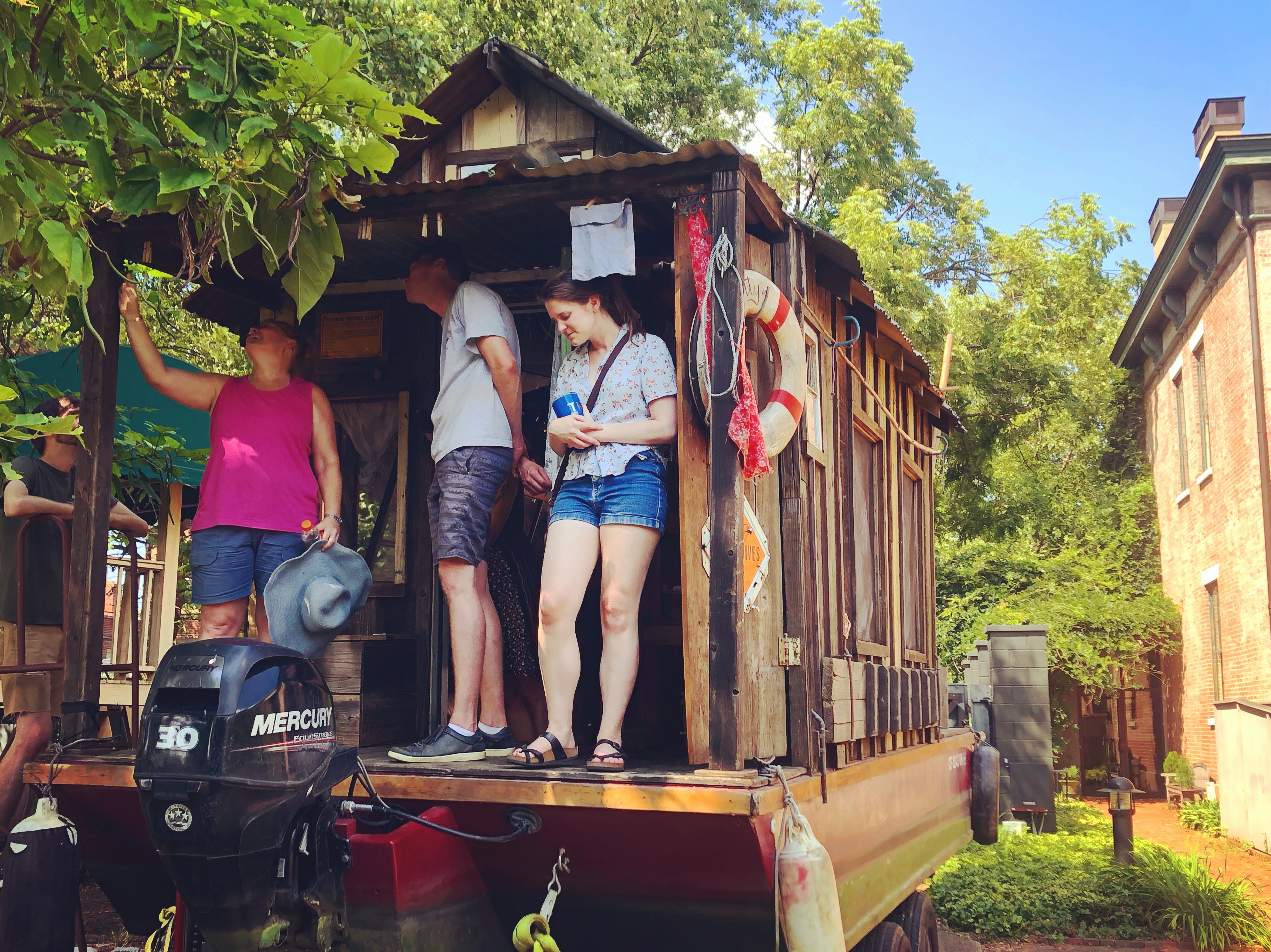 Visitors explore the shantyboat at the Portland Museum